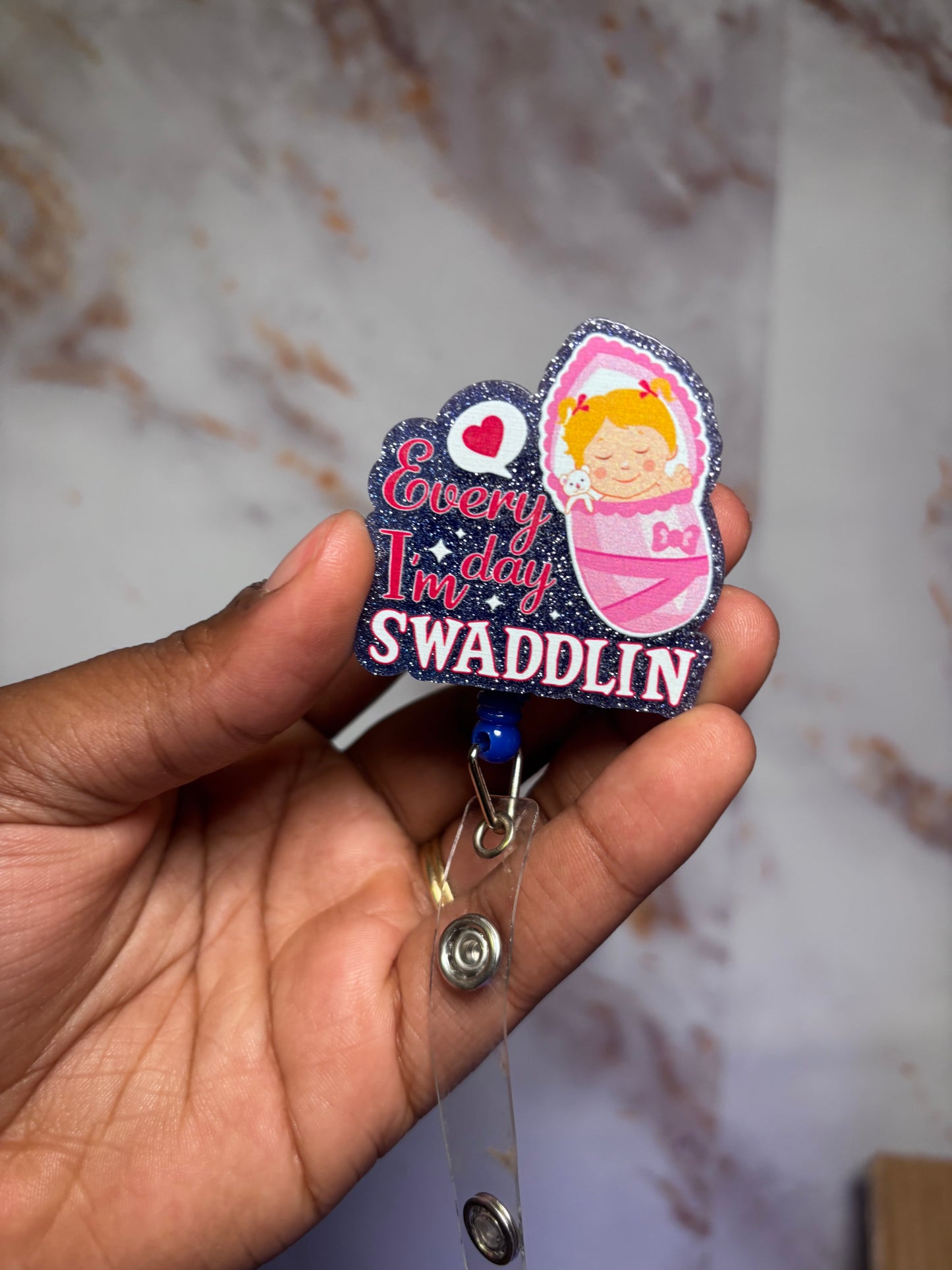 Swaddling badge